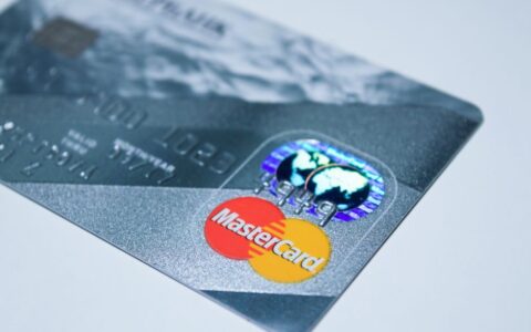 Detail shot of a MasterCard credit card, showing the chip and logo.